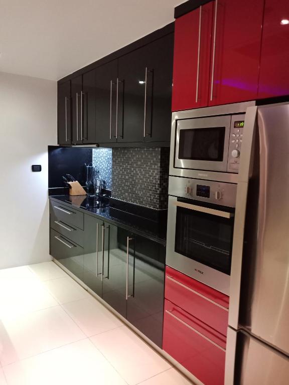 Kuchyň nebo kuchyňský kout v ubytování Absolute Bangla Suites