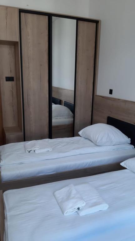 Łóżko lub łóżka w pokoju w obiekcie Aparthotel Łódź 55 Piotrkowska