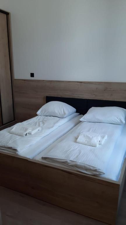 Łóżko lub łóżka w pokoju w obiekcie Aparthotel Łódź 55 Piotrkowska