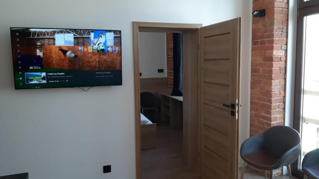 Telewizja i/lub zestaw kina domowego w obiekcie Aparthotel Łódź 55 Piotrkowska