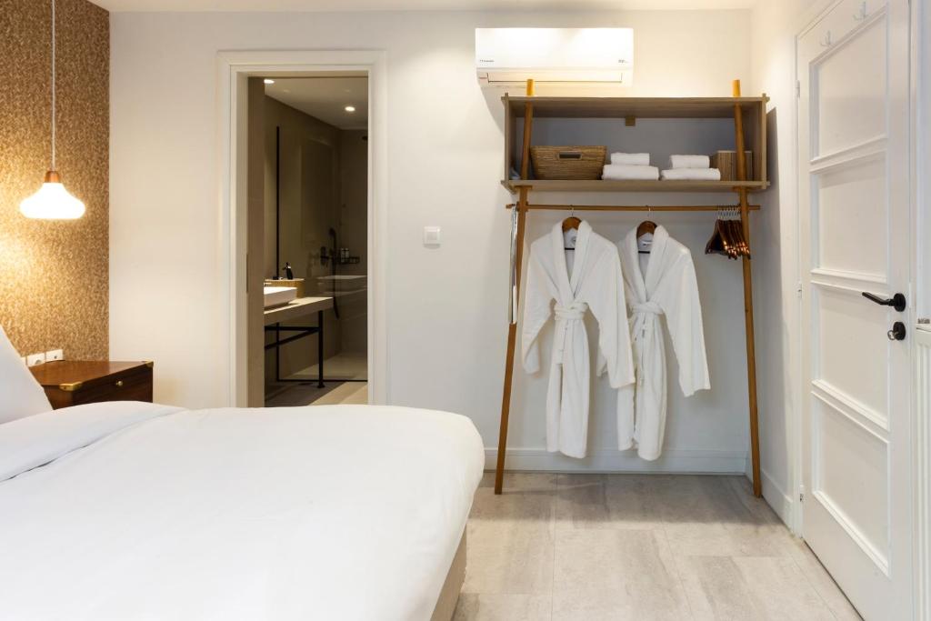 Posteľ alebo postele v izbe v ubytovaní SV Acropolis Residence