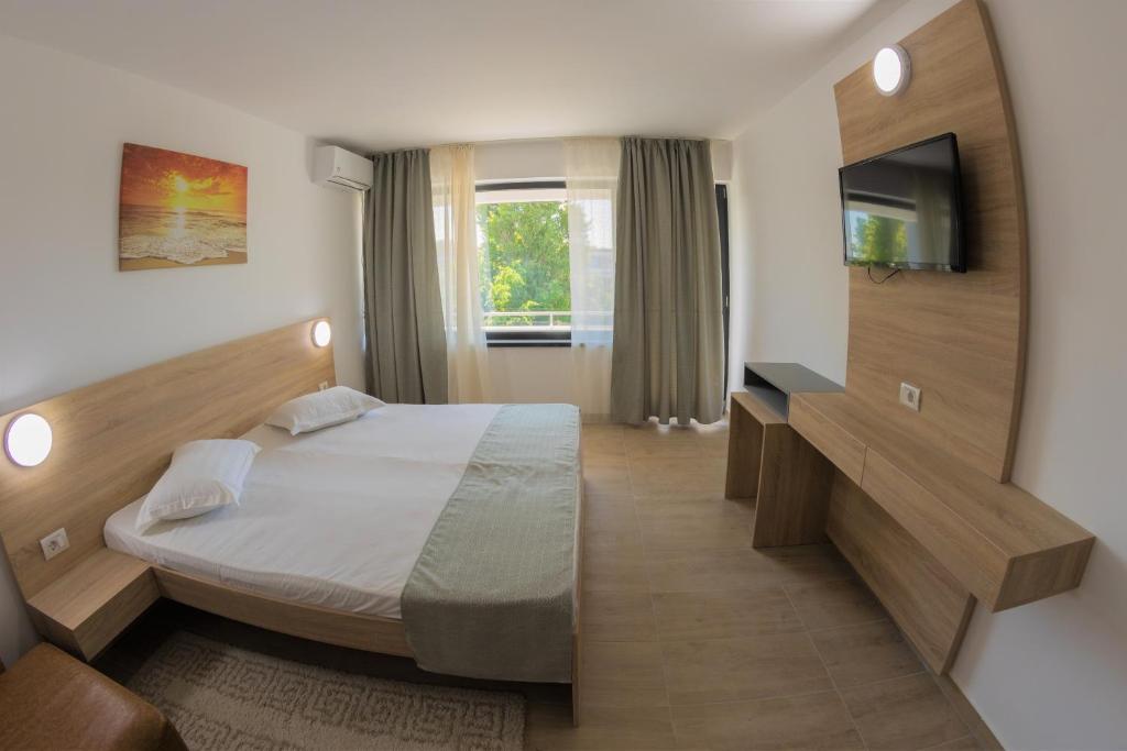 Postel nebo postele na pokoji v ubytování Hotel Gloria