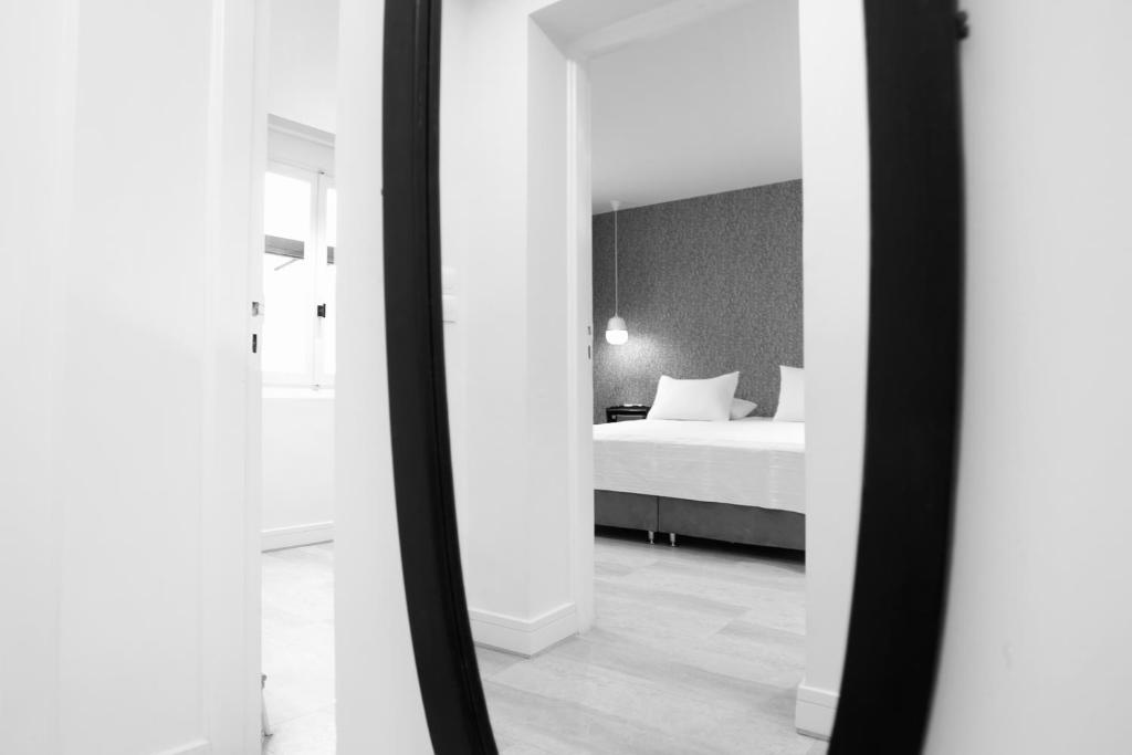Posteľ alebo postele v izbe v ubytovaní SV Acropolis Residence