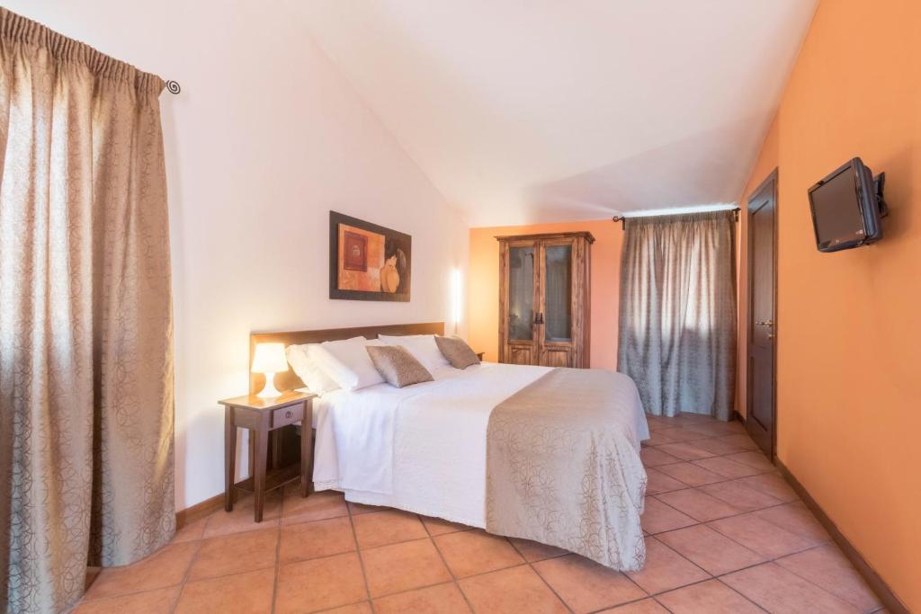 Postel nebo postele na pokoji v ubytování Residence Mugello Resort