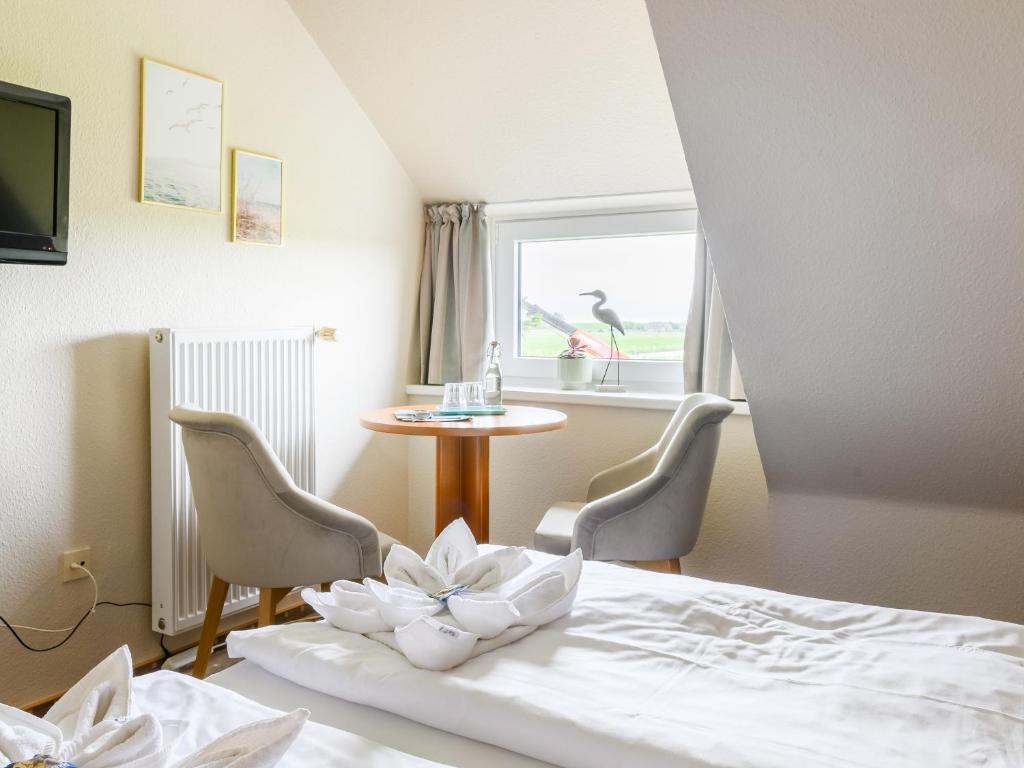 TV a/nebo společenská místnost v ubytování Nordsee-Hotel Arlau-Schleuse