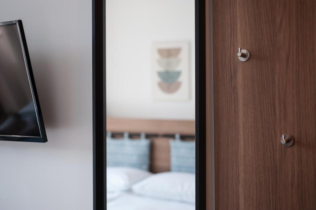 Postel nebo postele na pokoji v ubytování B&B Pod vrbo