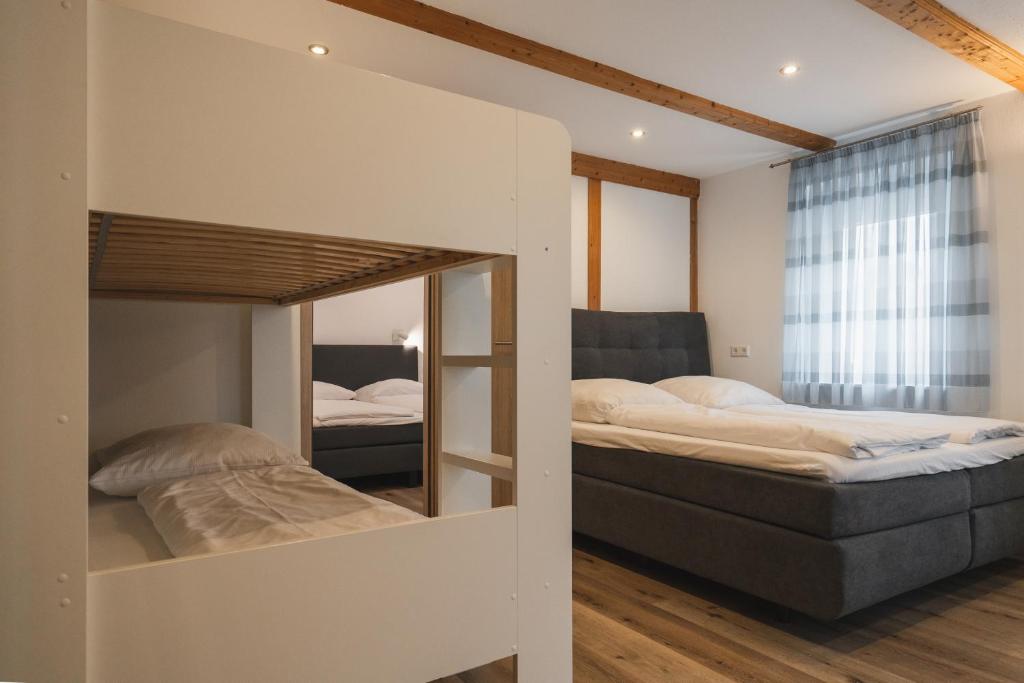 Postel nebo postele na pokoji v ubytování Park Hotel & Gästehaus Rust