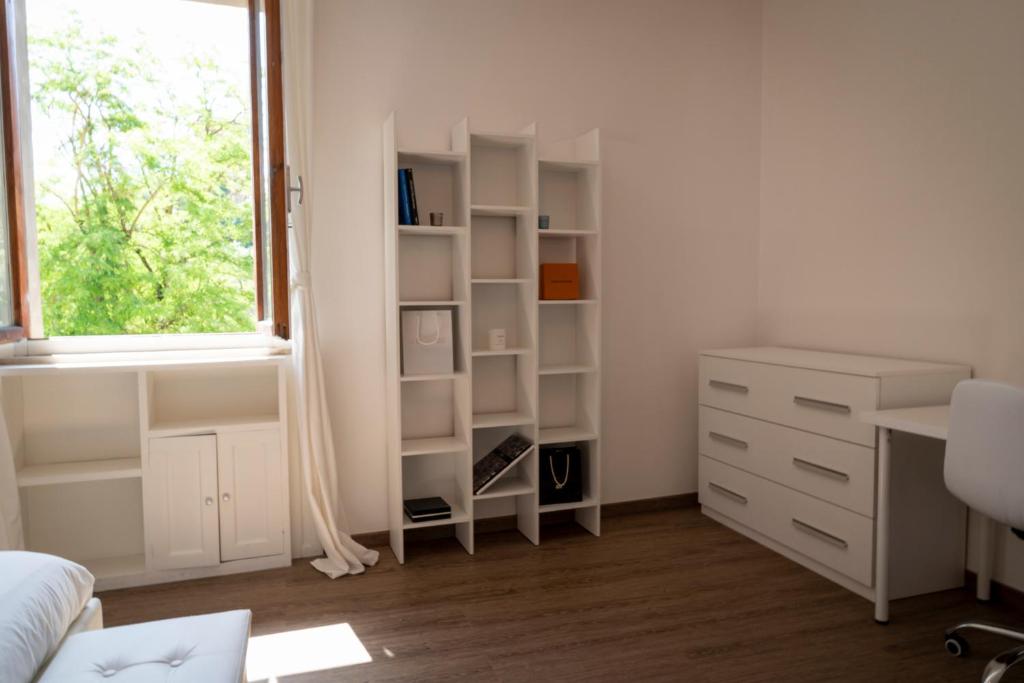 Televízia a/alebo spoločenská miestnosť v ubytovaní PORTA OVILE CIVICO 5