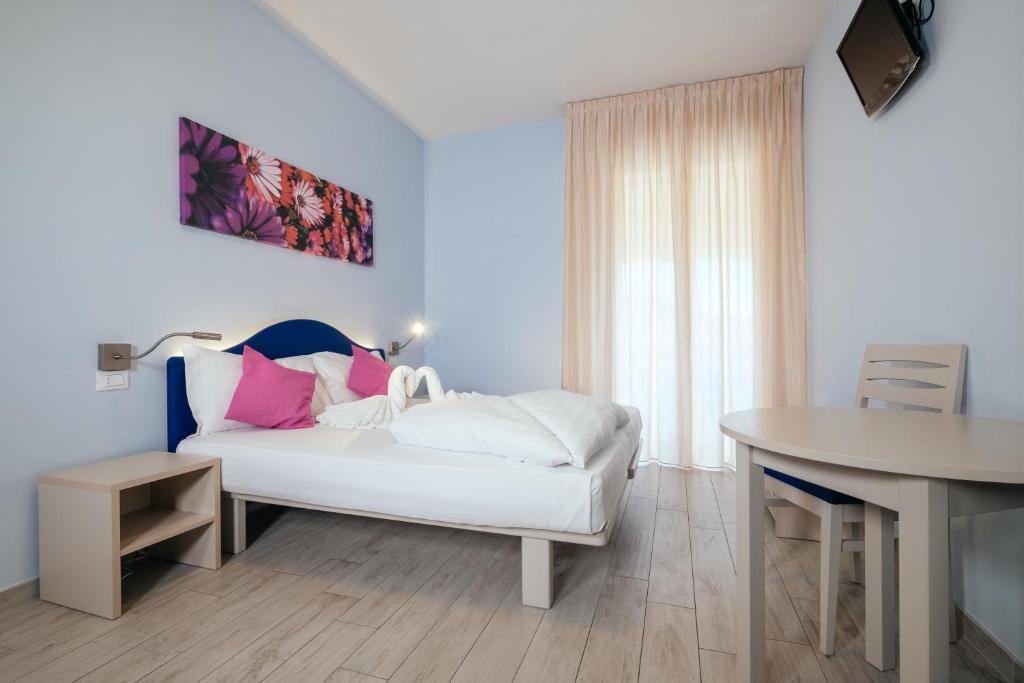 Postel nebo postele na pokoji v ubytování Hotel Firenze 3 Stelle Superior