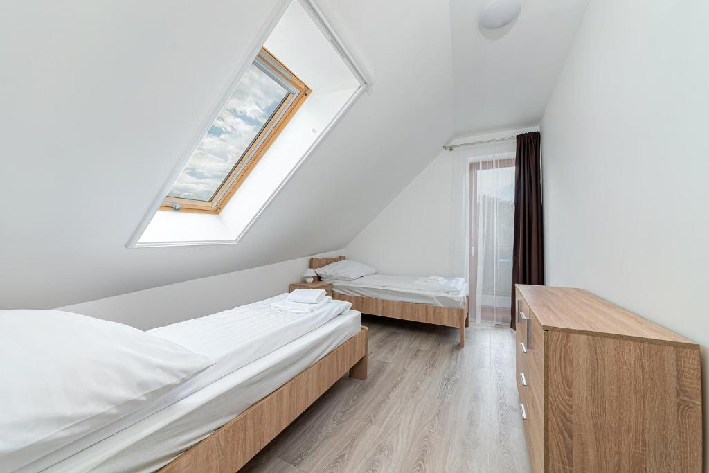 Postel nebo postele na pokoji v ubytování Hérics Apartman