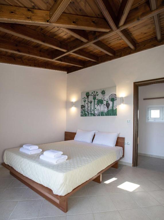 A bed or beds in a room at Spacious House with extraordinary view in Corfu