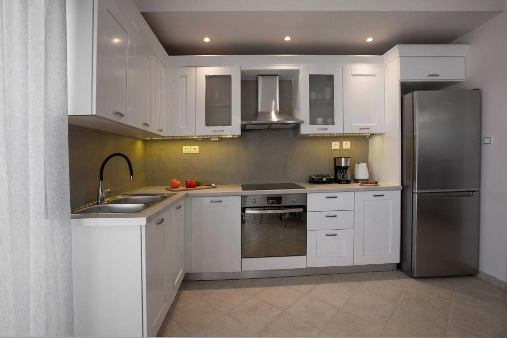 A kitchen or kitchenette at Spacious House with extraordinary view in Corfu