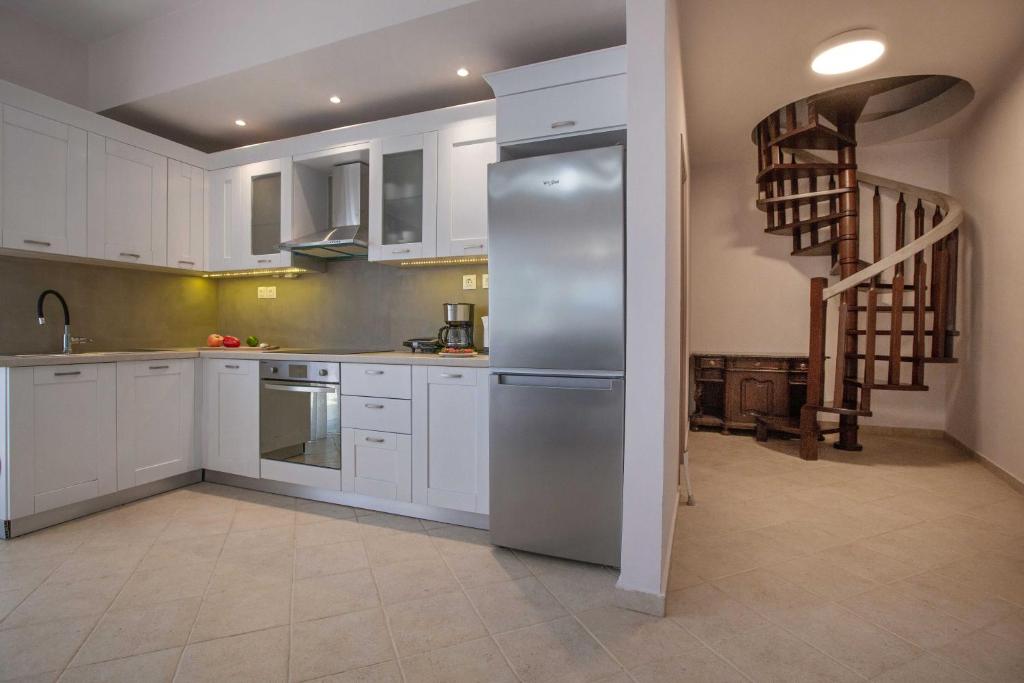 A kitchen or kitchenette at Spacious House with extraordinary view in Corfu