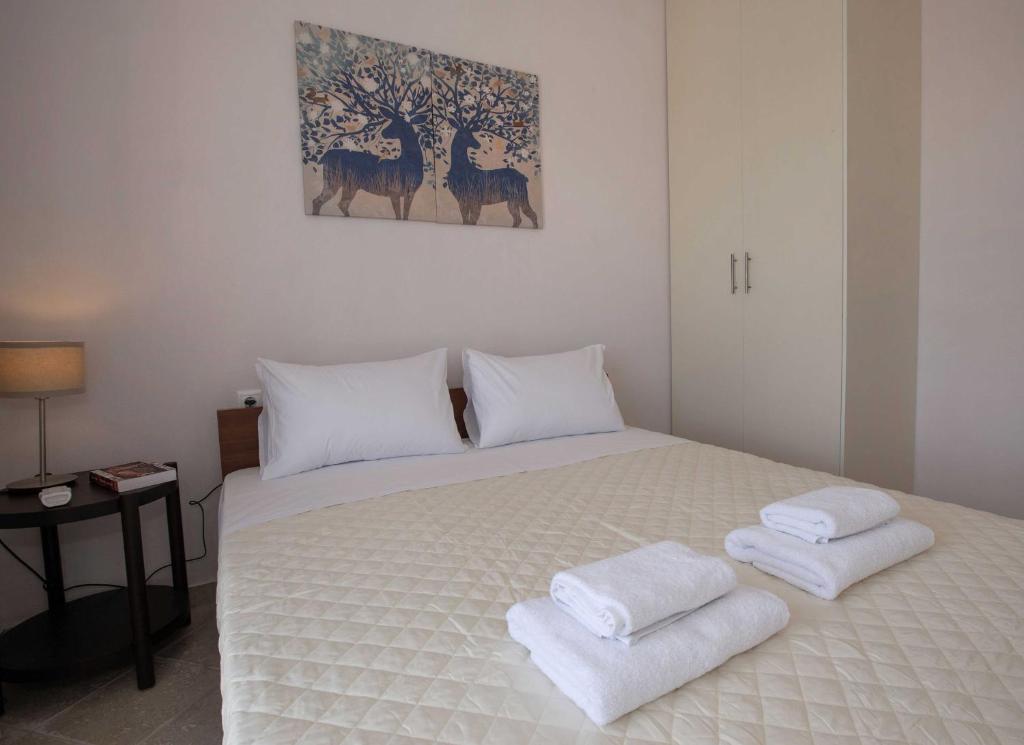 A bed or beds in a room at Spacious House with extraordinary view in Corfu