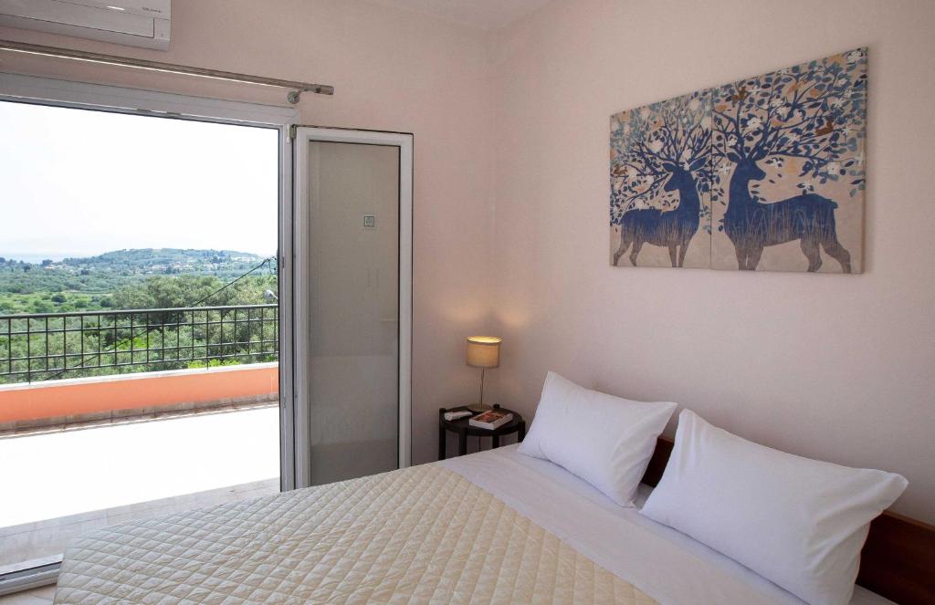 A bed or beds in a room at Spacious House with extraordinary view in Corfu