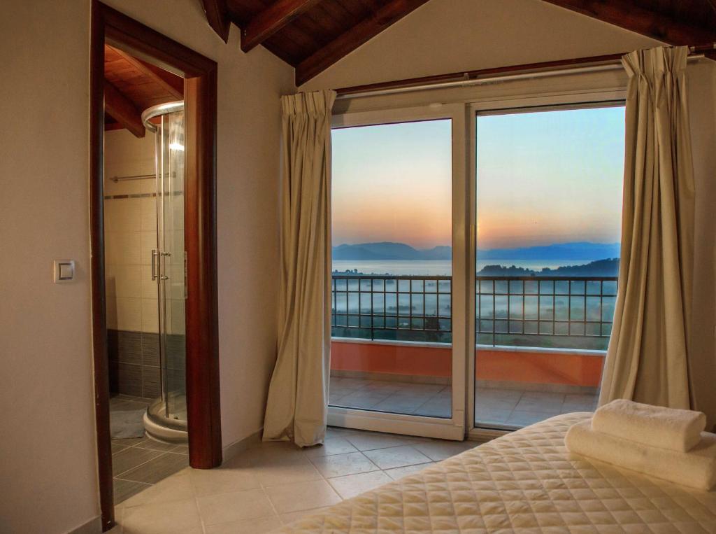 A bed or beds in a room at Spacious House with extraordinary view in Corfu