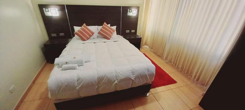 Postel nebo postele na pokoji v ubytování Hotel Mantas Cusco