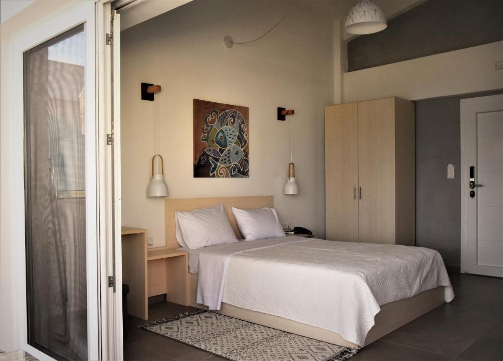 Postel nebo postele na pokoji v ubytování Steleni Seaside Apartments