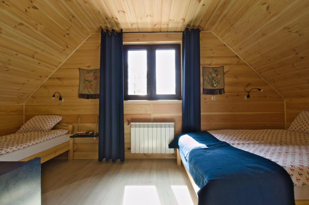 Кровать или кровати в номере Domek w Biebrzańskim Eldorado