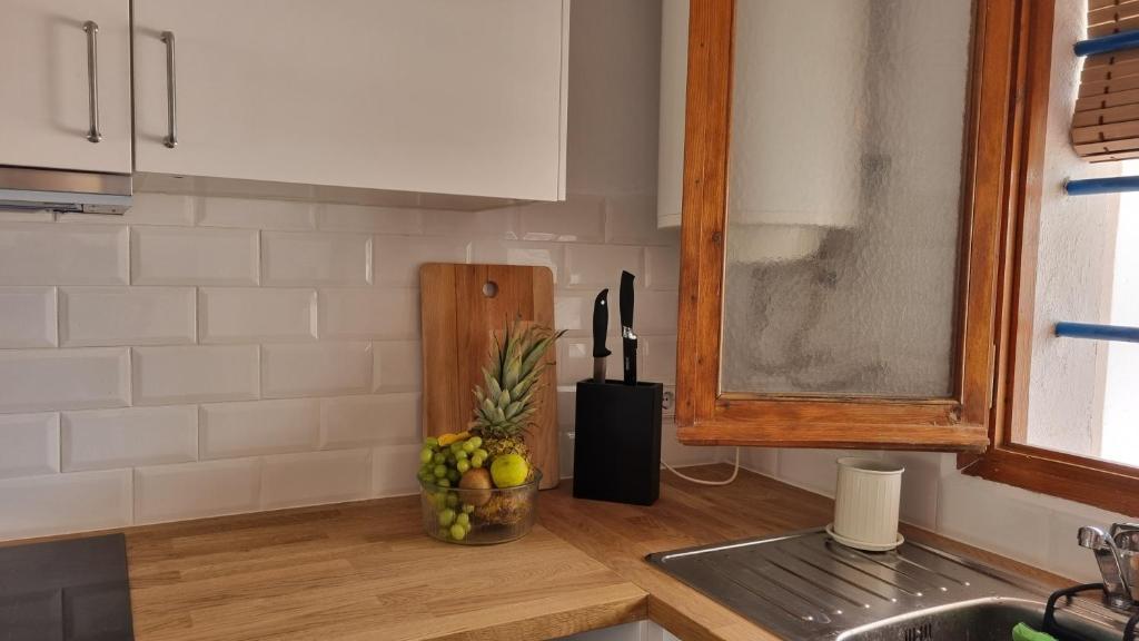 Kuchyň nebo kuchyňský kout v ubytování Apartamento familiar con piscina y wifi