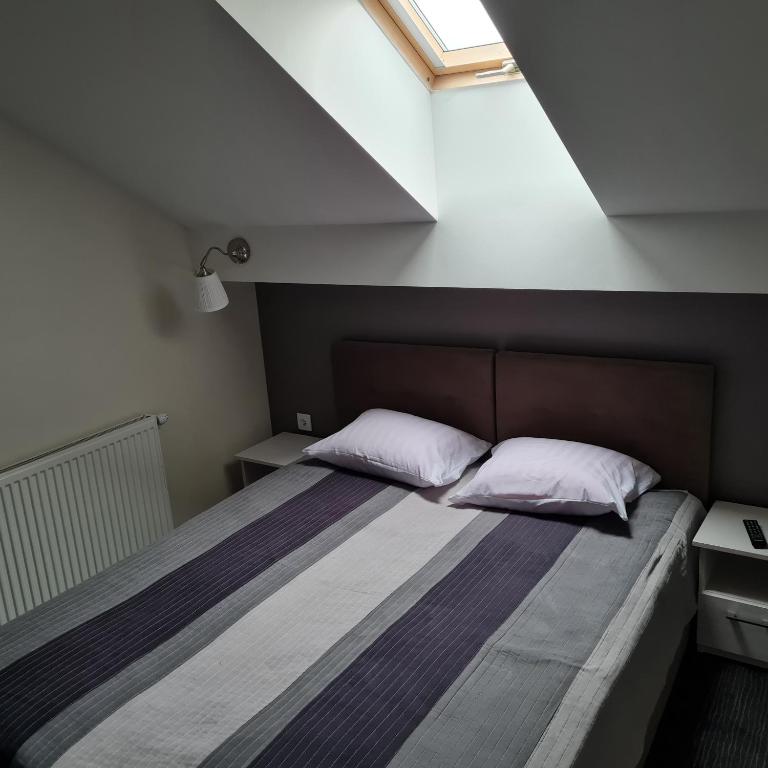 Posteľ alebo postele v izbe v ubytovaní Apartament Wileńska