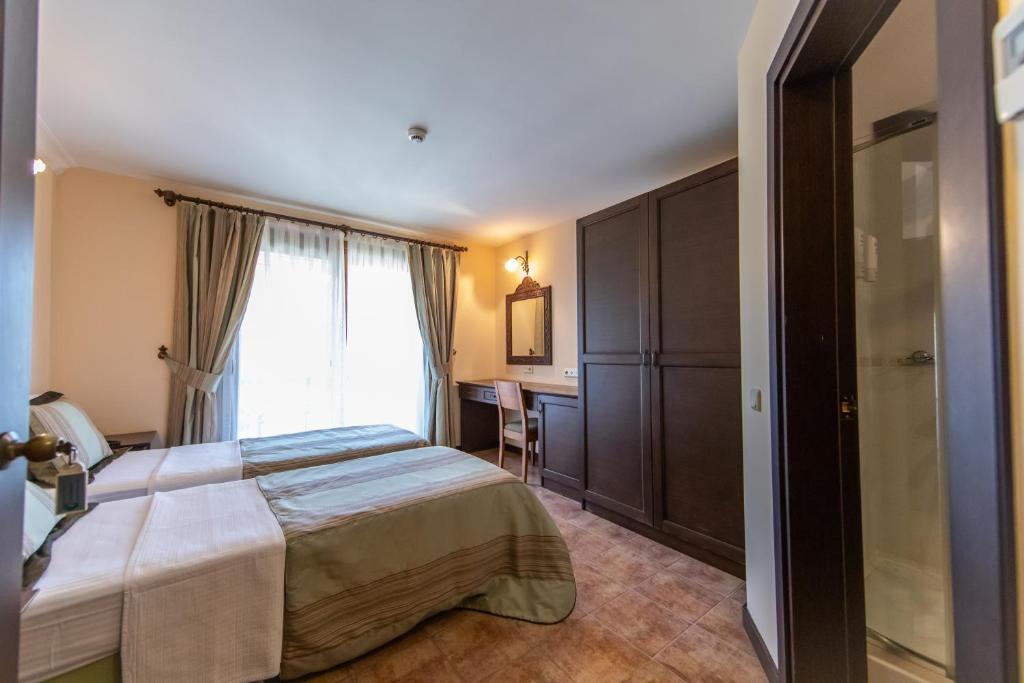 Postel nebo postele na pokoji v ubytování Ipek Garden Palace Residence
