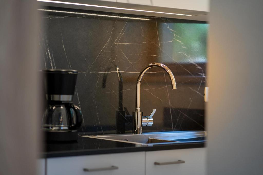 Kuchyň nebo kuchyňský kout v ubytování Garnì Lasteis B&B - apartments