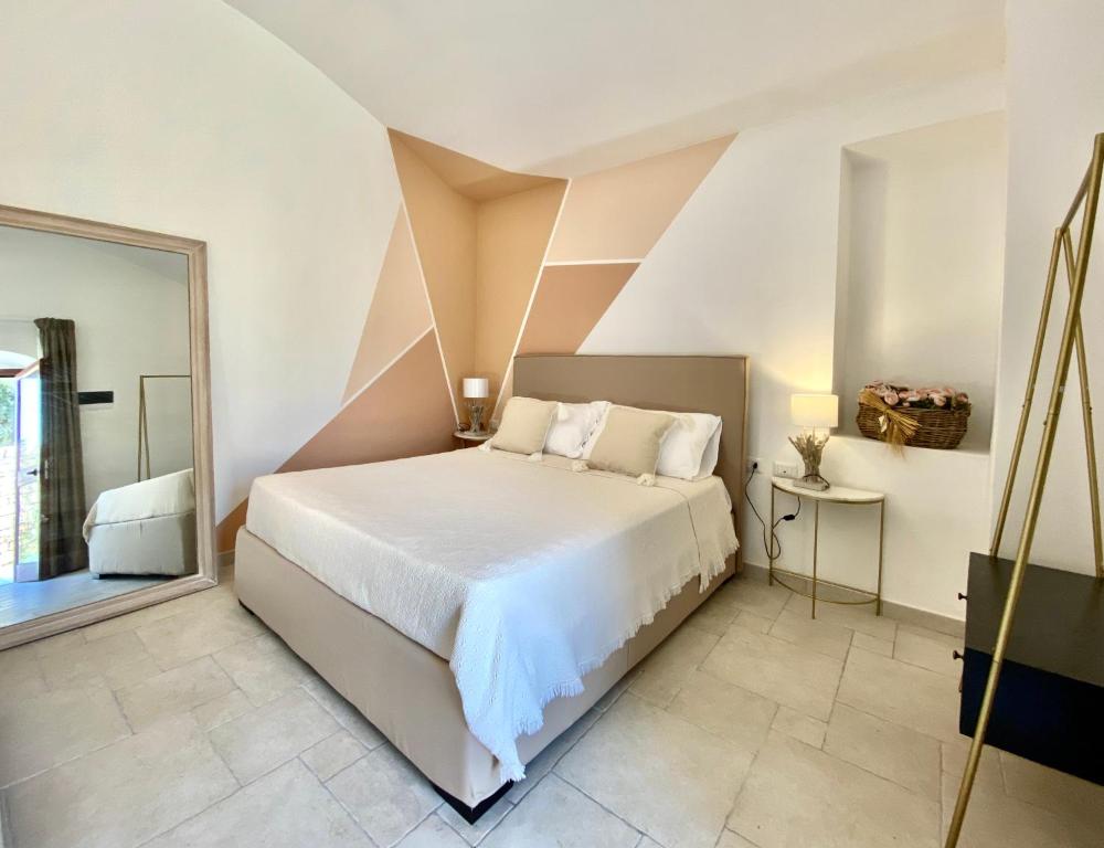 Łóżko lub łóżka w pokoju w obiekcie B&B Torre Sibissi Bari