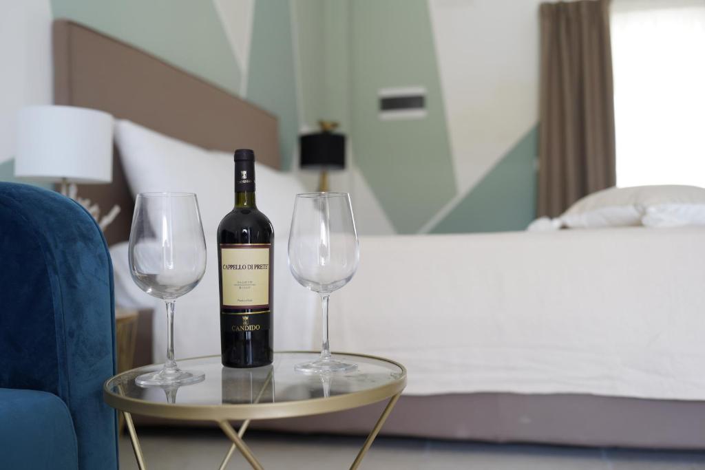 Łóżko lub łóżka w pokoju w obiekcie B&B Torre Sibissi Bari