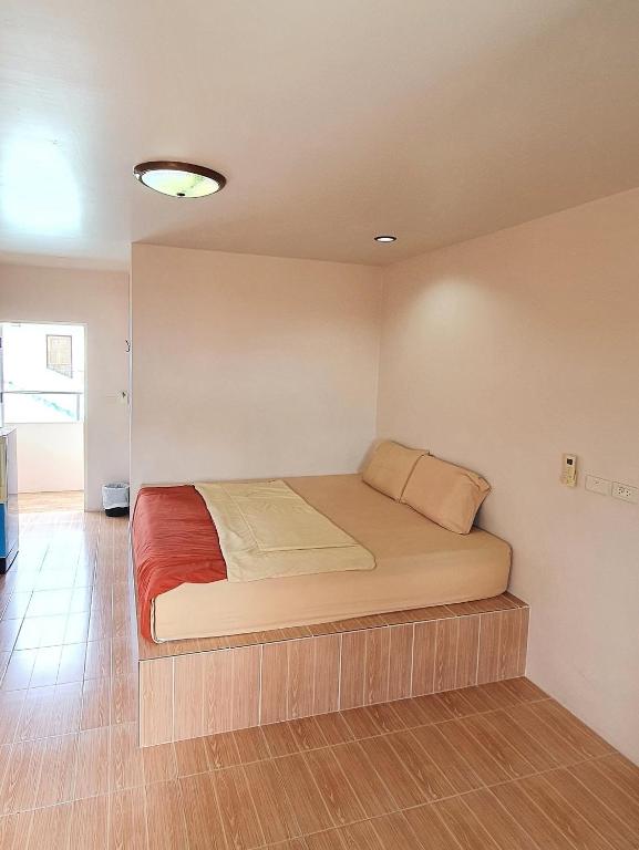 Postel nebo postele na pokoji v ubytování Sairee Center Guest House