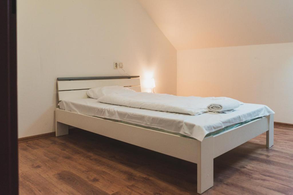 Postel nebo postele na pokoji v ubytování Penzion Rollba