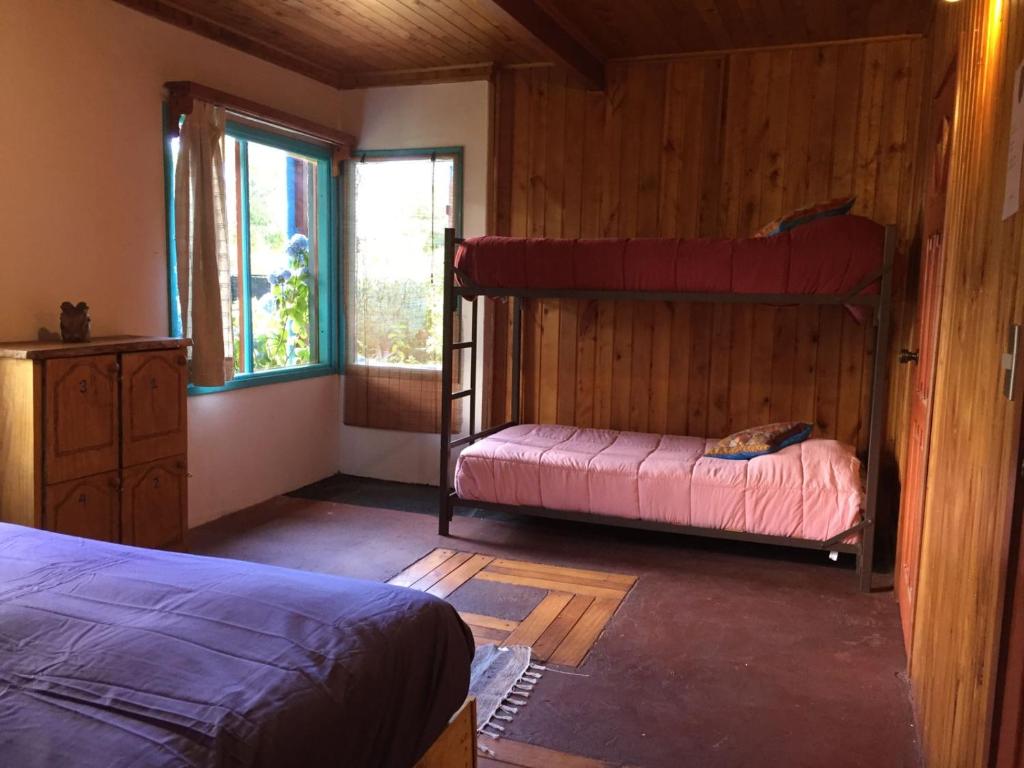 Uma cama ou camas num quarto em Hostel Raíz