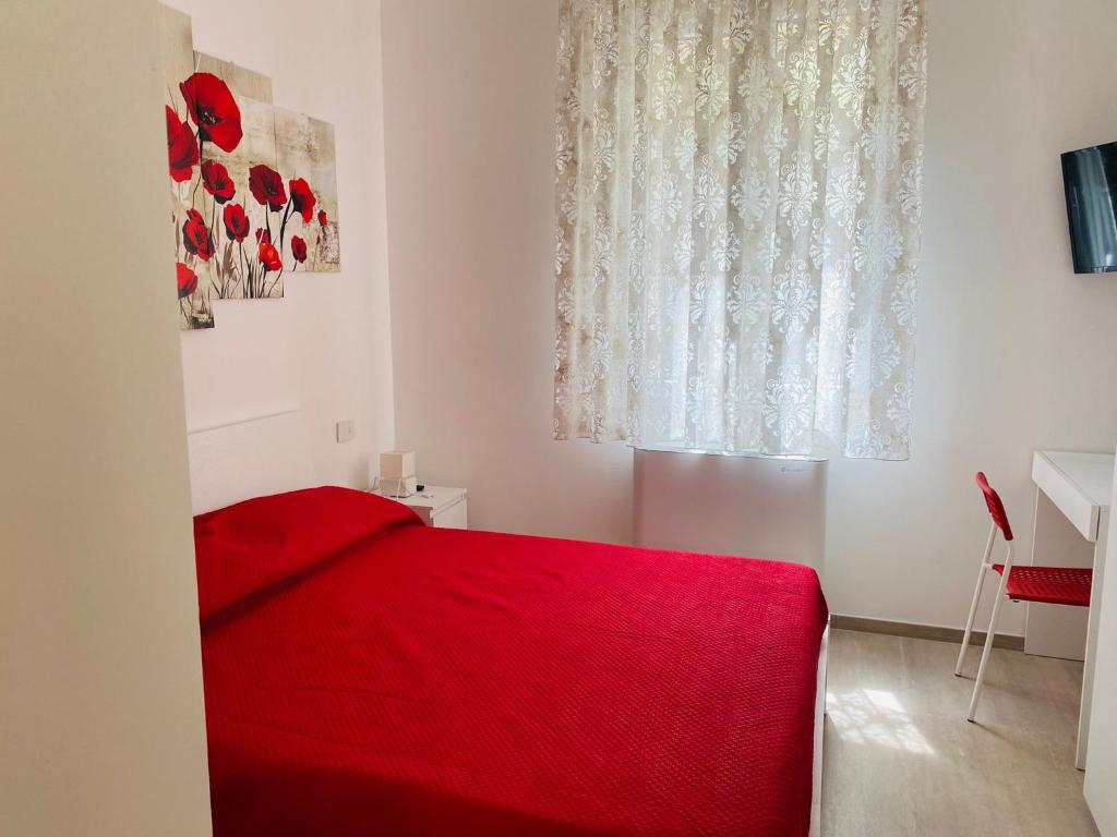 Posteľ alebo postele v izbe v ubytovaní La Casa di Chiara