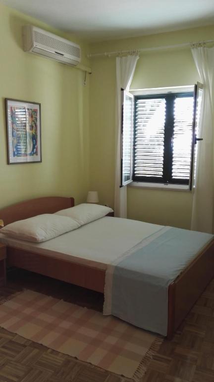 Posteľ alebo postele v izbe v ubytovaní Apartment Dalma