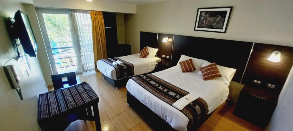 Postel nebo postele na pokoji v ubytování Hotel Mantas Cusco