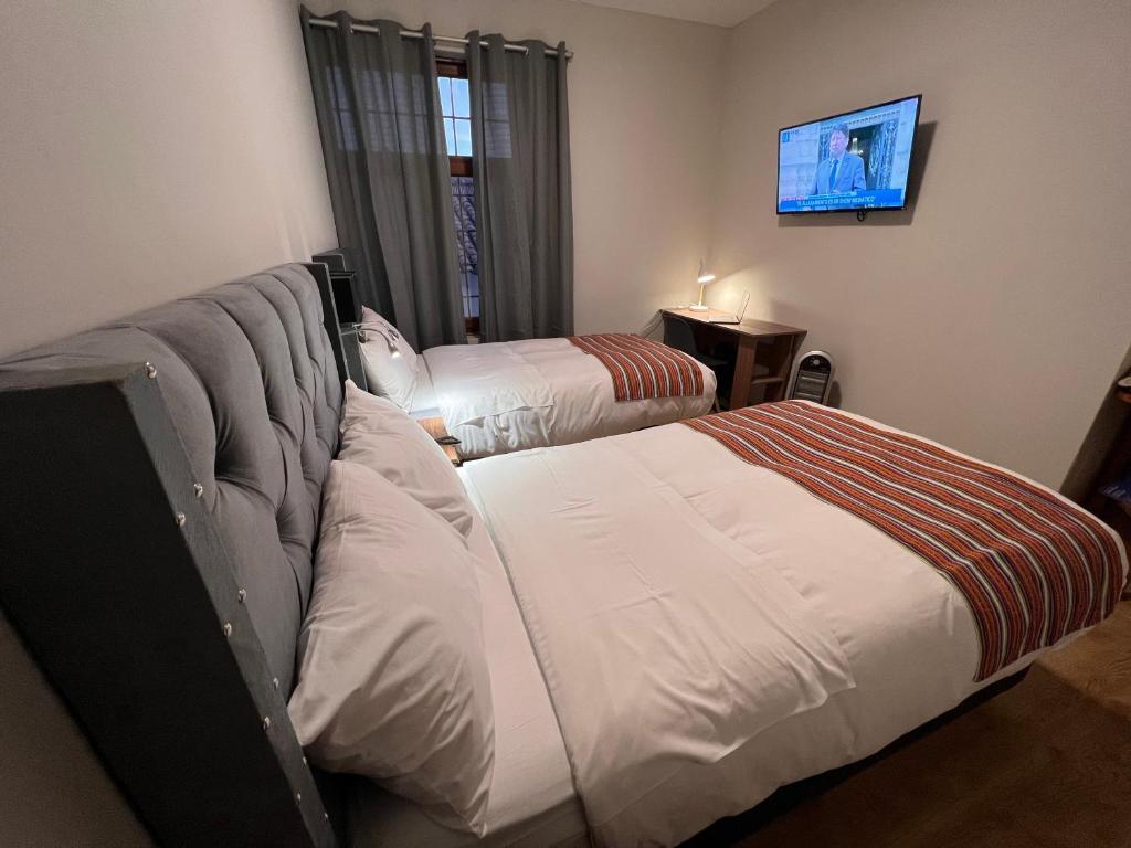 Postel nebo postele na pokoji v ubytování Casona Plaza Hotel Cusco