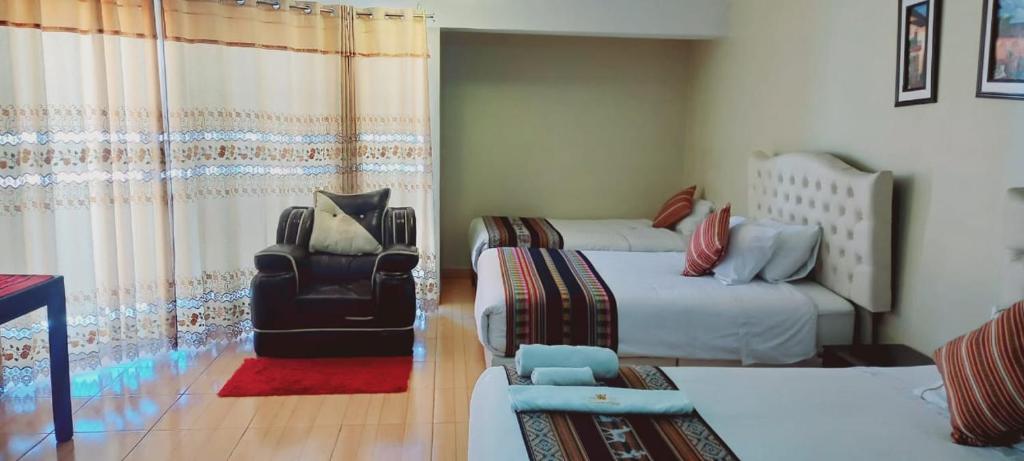 Postel nebo postele na pokoji v ubytování Hotel Mantas Cusco