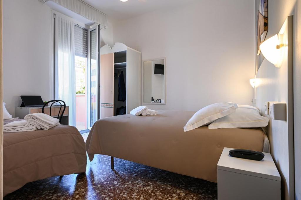 Postel nebo postele na pokoji v ubytování Amadei Hotel Blumen