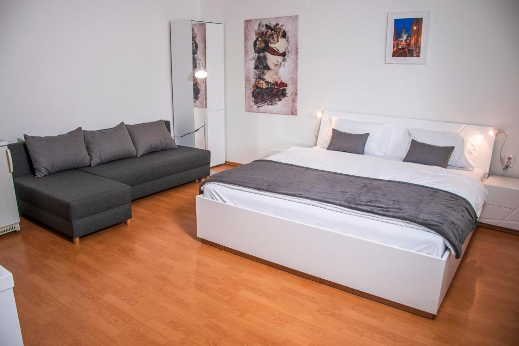 Postel nebo postele na pokoji v ubytování Apartmány EMMA