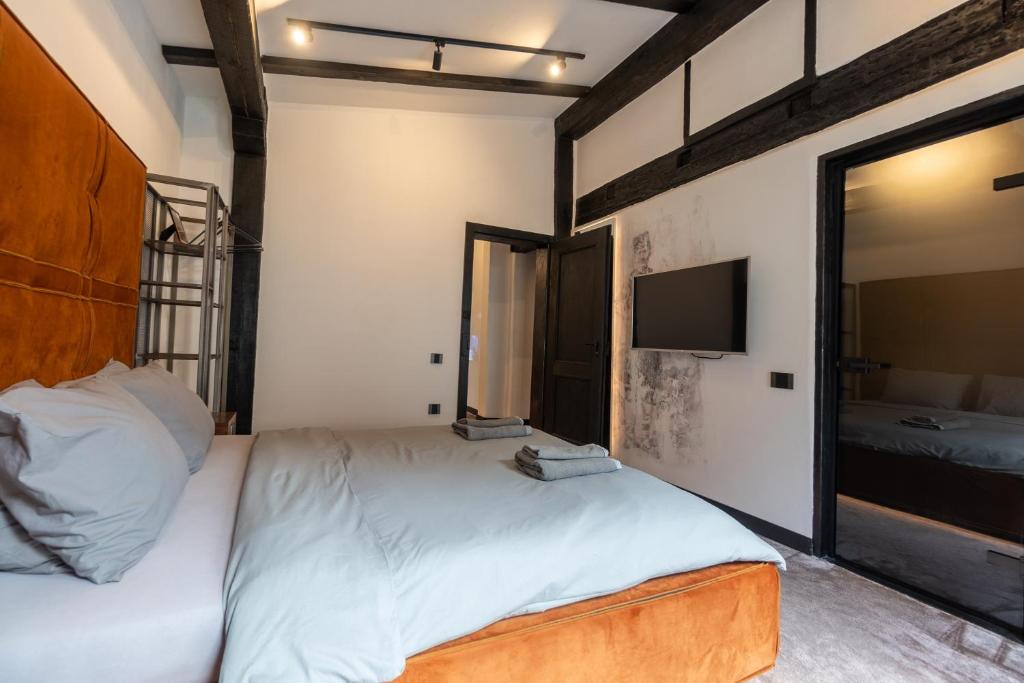 Postel nebo postele na pokoji v ubytování Bashtin Dom - Skabrin House