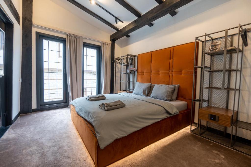 Postel nebo postele na pokoji v ubytování Bashtin Dom - Skabrin House