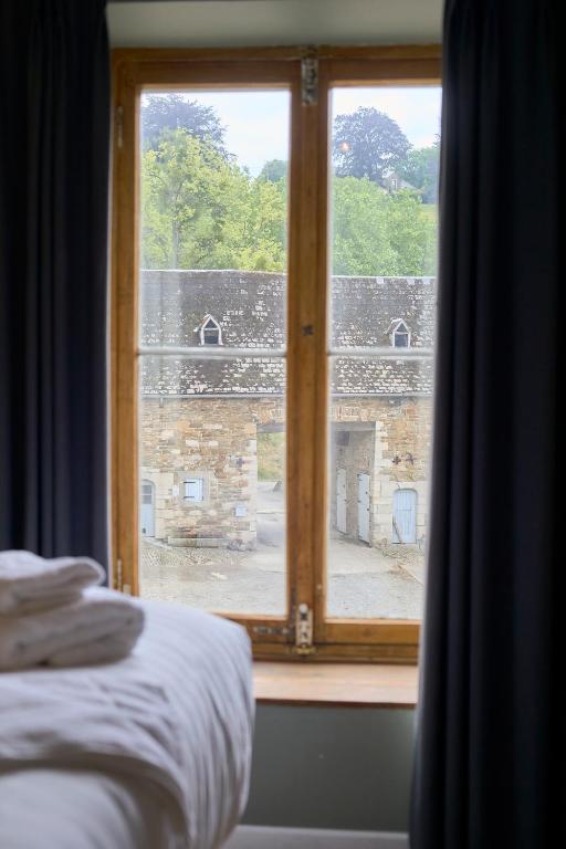 Postel nebo postele na pokoji v ubytování Château de la Chapelle