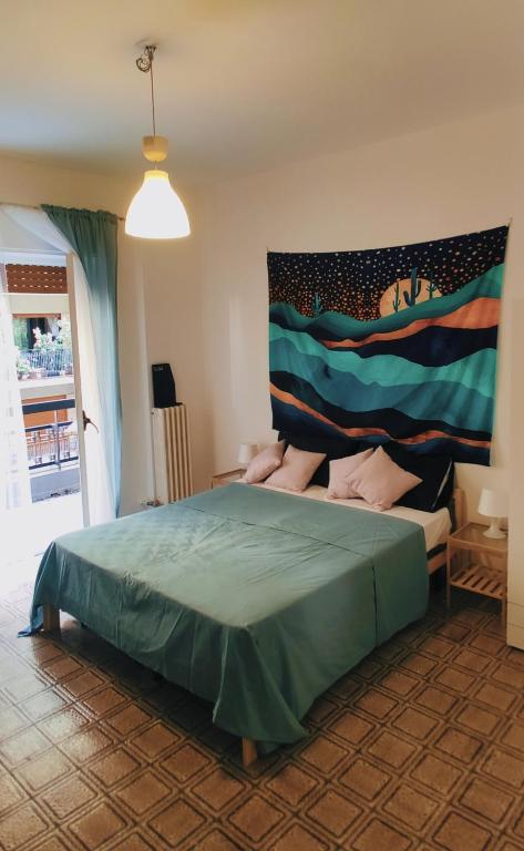 a bedroom with a bed with a painting on the wall at Nicolai63 in Bari