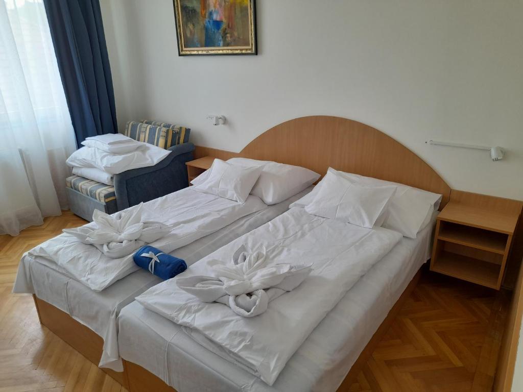 Postel nebo postele na pokoji v ubytování Nimród Vendégház