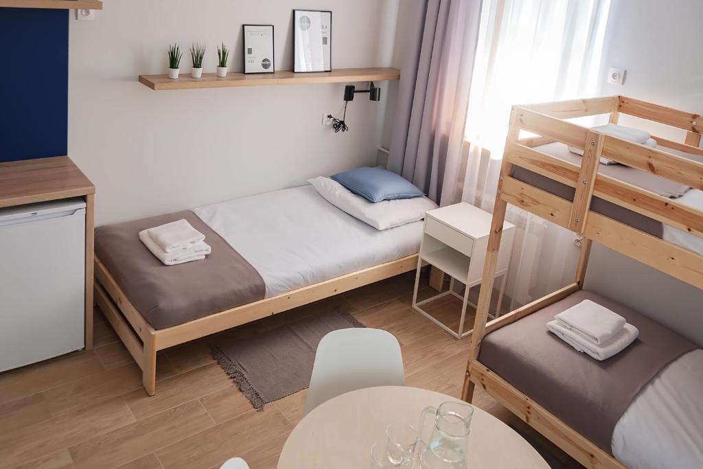 Postel nebo postele na pokoji v ubytování Apart Hostel S8