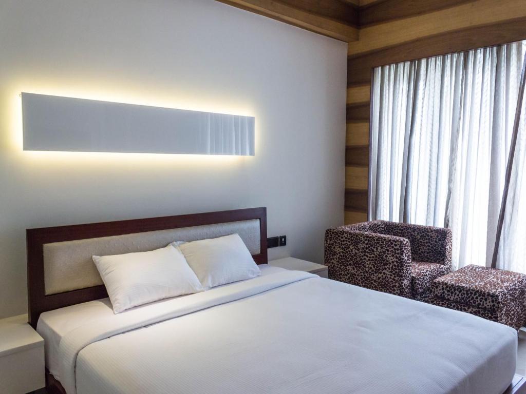 Postel nebo postele na pokoji v ubytování Diana Heights Luxury Hotel