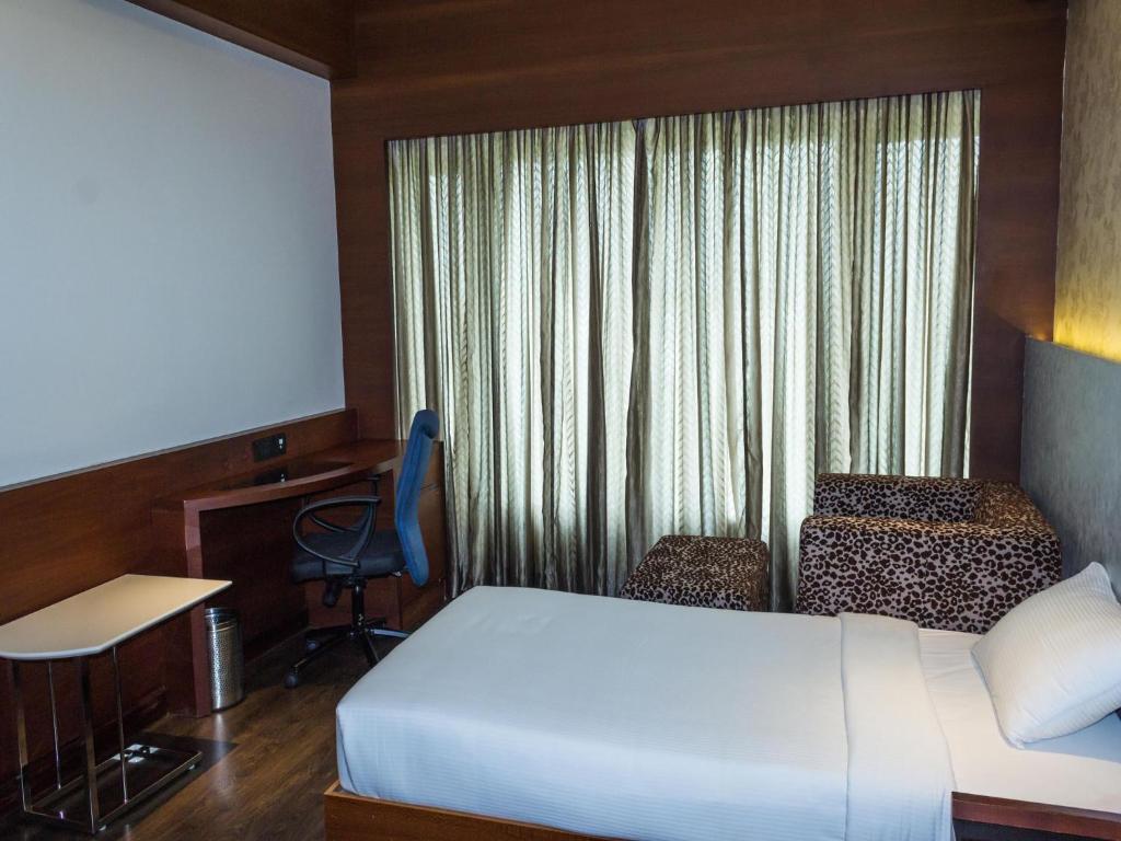 Postel nebo postele na pokoji v ubytování Diana Heights Luxury Hotel