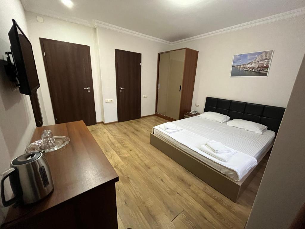 Postel nebo postele na pokoji v ubytování Ventura Hotel