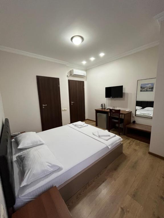 Postel nebo postele na pokoji v ubytování Ventura Hotel