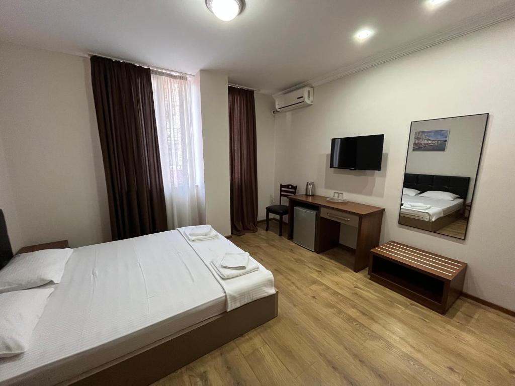 Postel nebo postele na pokoji v ubytování Ventura Hotel